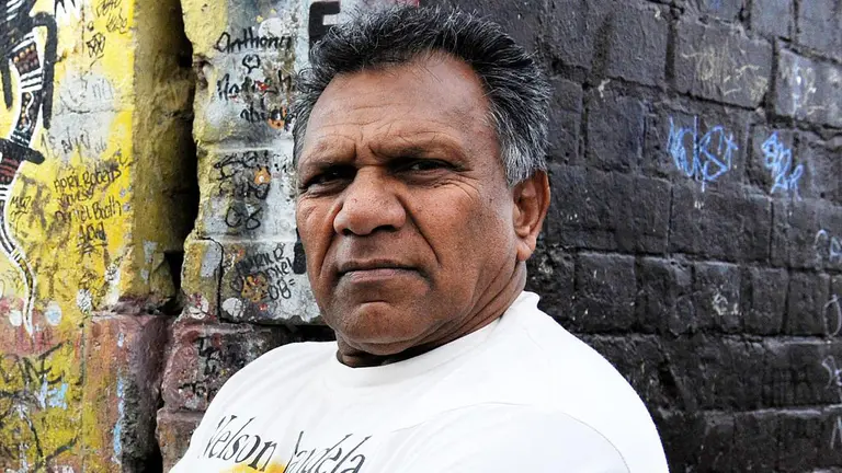 Sydney Indigenous leader Mick Mundine charged over historical child sexual assault allegations