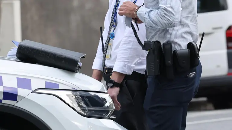 Man, 60, arrested after body found inside Carlton apartment complex