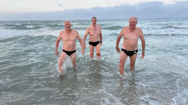 ‘Feel more vulnerable’: Swimmers return to Sorrento Beach, month after Greg O’Neil killed by shark