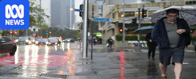 Roads and schools closed as flash flooding hits south-east Queensland