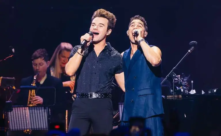 Glee fans go wild as Chris Colfer joins Darren Criss for a duet at London concert
