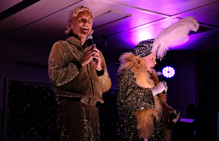 A comedian and local drag queen ‘crack up’ themselves and the crowd