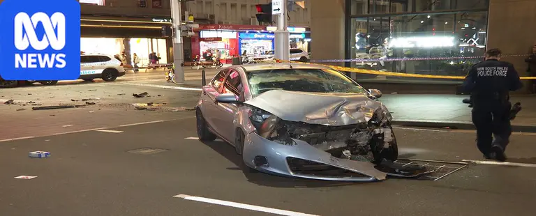 Man charged after pedestrian, police car struck in Sydney CBD carjacking
