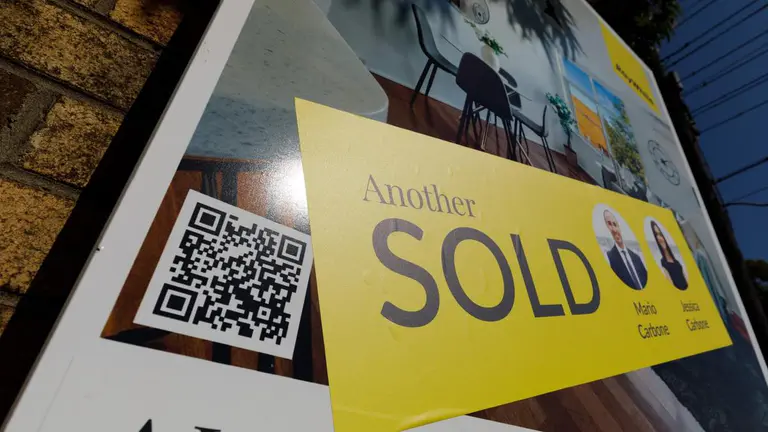 Australian parents warned falling house prices could trap loan guarantors for 14 years
