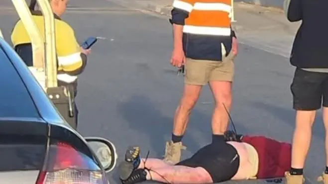 Wild moment tradies tackle, zip-tie masked axeman after alleged carjacking attempt on Melbourne road