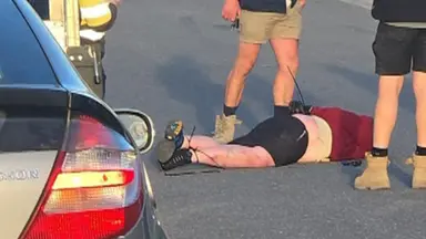Axe-wielding man tackled by tradies after alleged carjacking attempt in Melbourne’s north