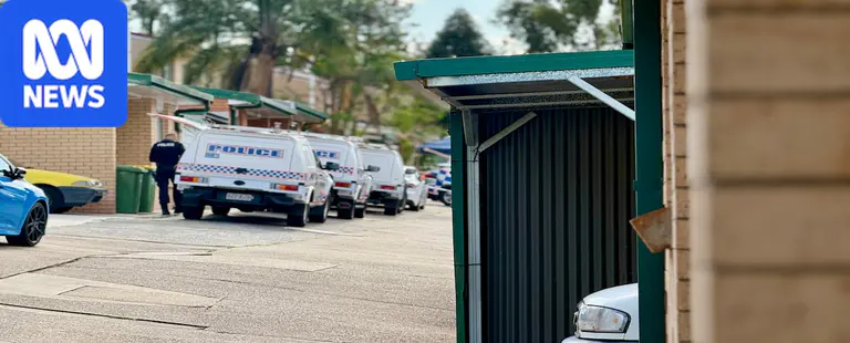 Man charged with murder after body found in Logan unit